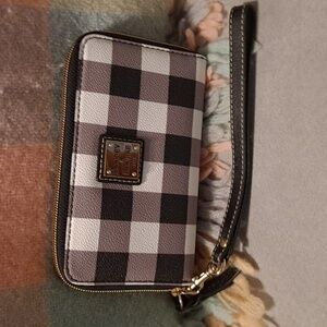 Dooney and Bourke zip around wallet in black and white plaid coated cotton